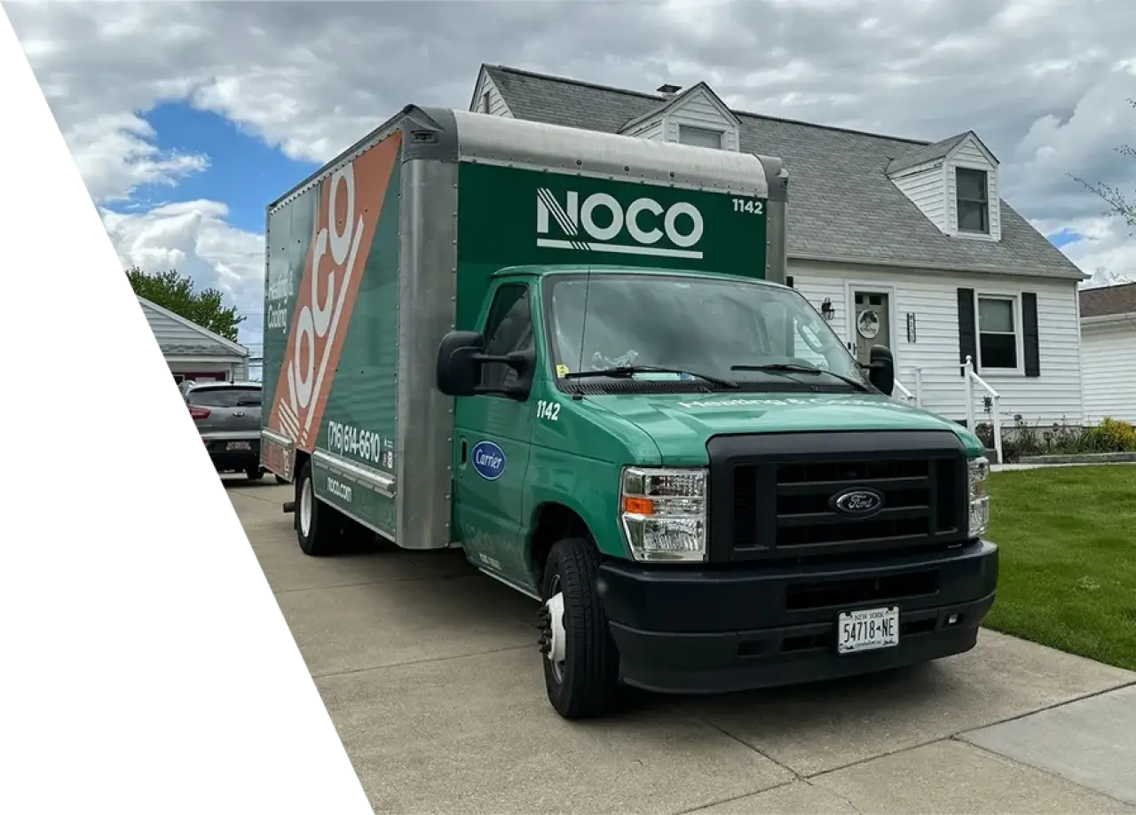 NOCO green service truck parked in front of a residential home