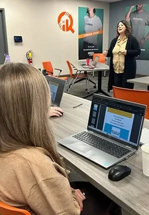 NOCO team member reviewing energy plans at a desk