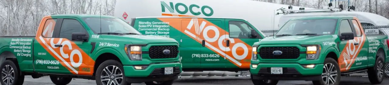 Fleet of NOCO green service trucks lined up at a depot