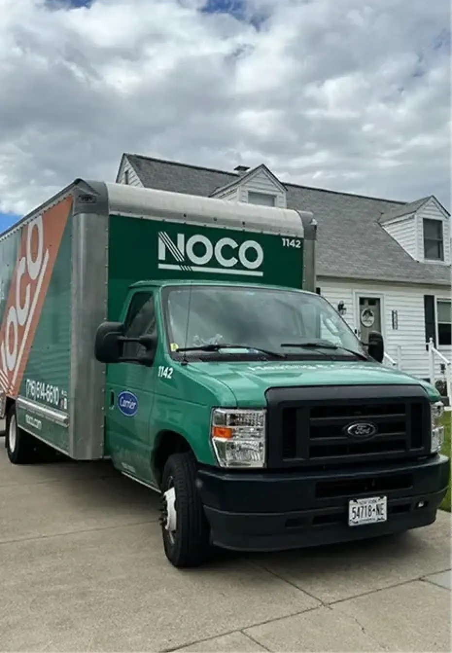 NOCO team member reviewing energy plans at a desk