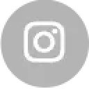 Gray Instagram logo centered on a light gray background with rounded corners and subtle dark specks.