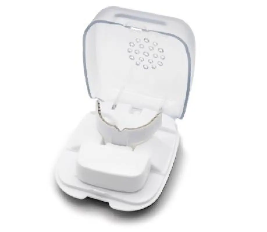 A clear dental retainer in a white open storage case with a transparent lid.