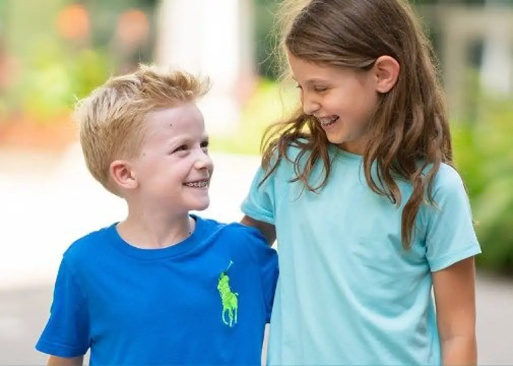 Patient smiling after orthodontic treatment.