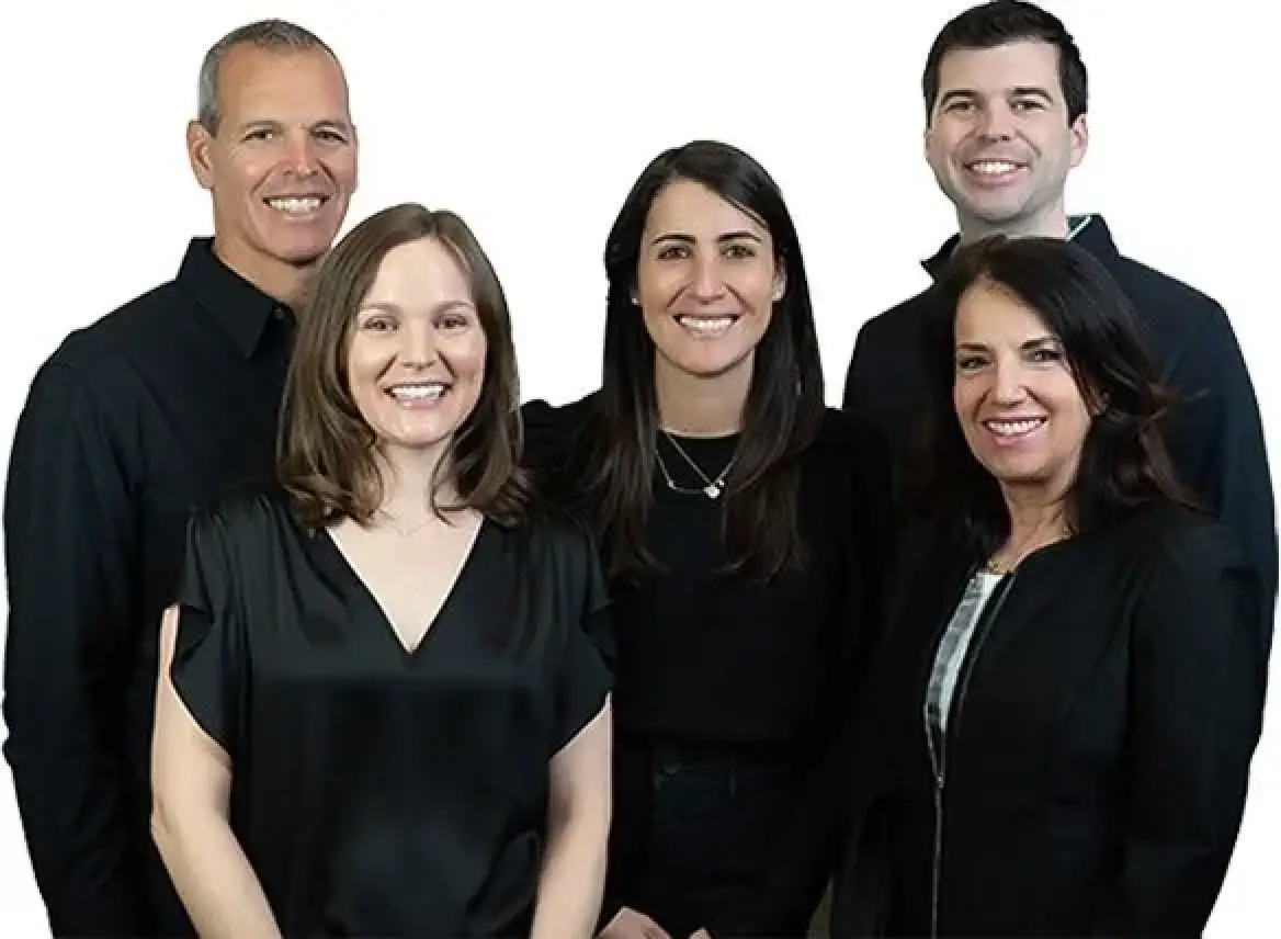 Five smiling people in black clothing, standing together against a white background.
