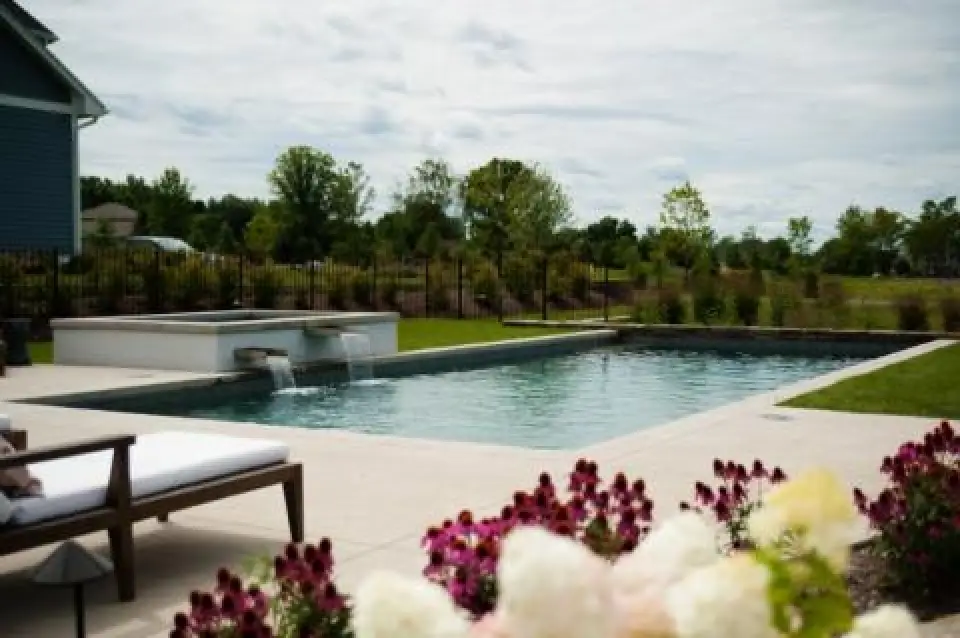 backyard pool with spa and lounge chair