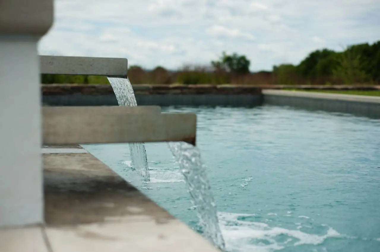 close up of waterfall effects from the hot tub to the pool