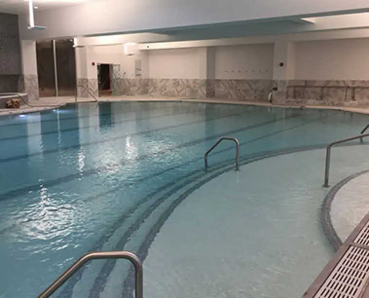 wide steps leading down into a commercial pool