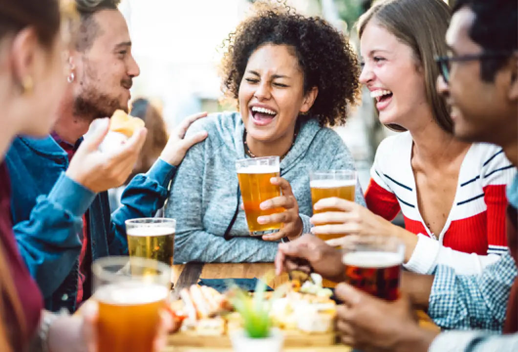 friends drinking beers at a table