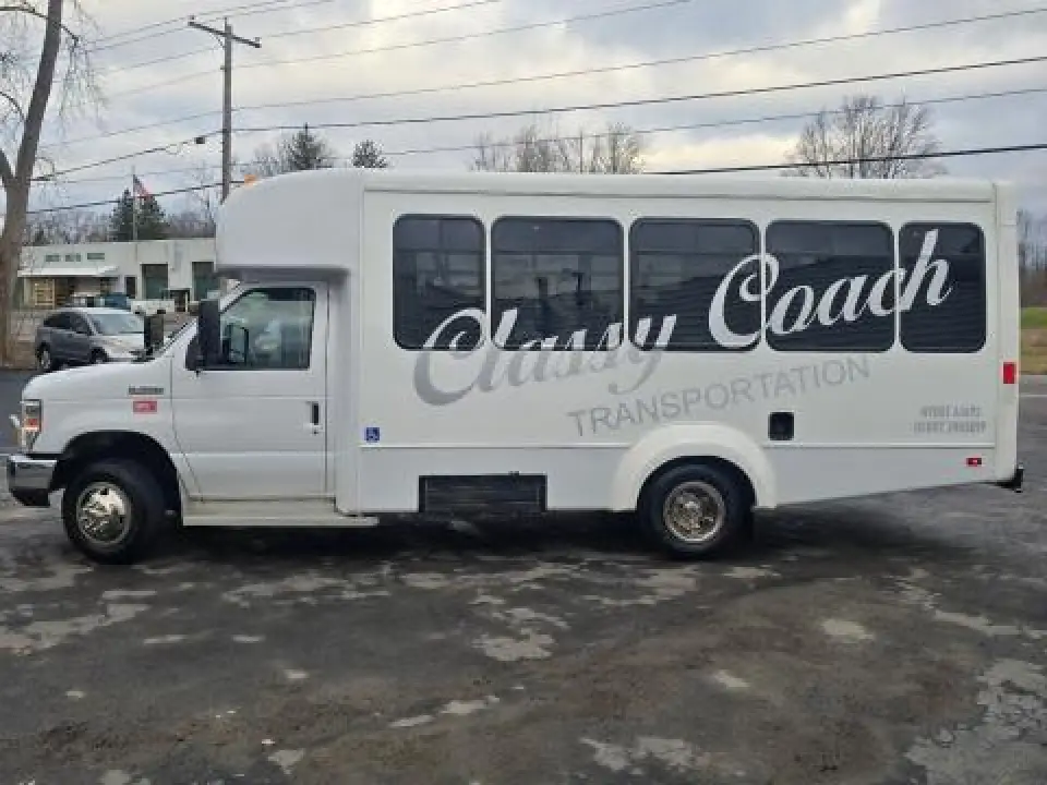 Classy Coach wheelchair-accessible passenger bus viewed from the side.