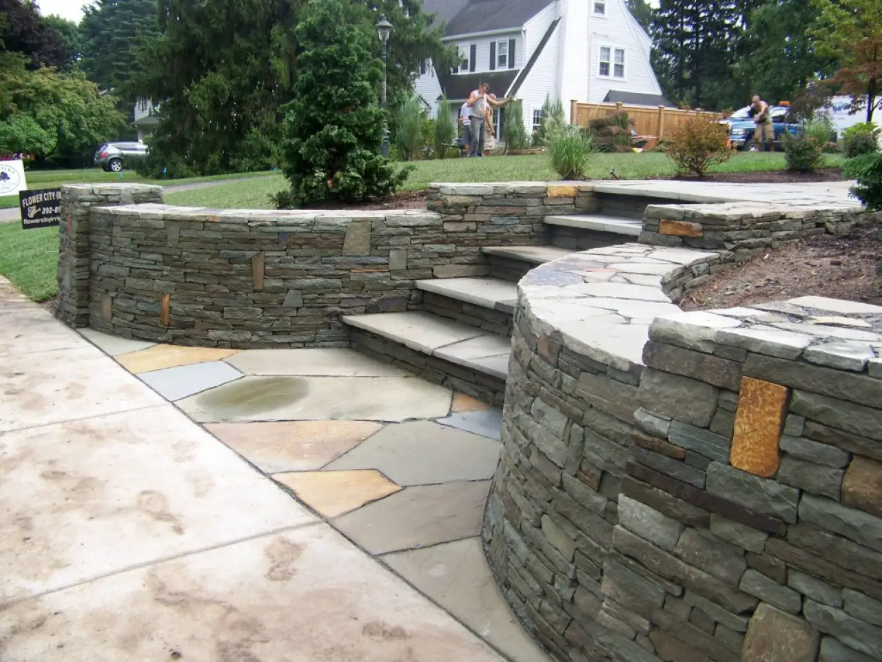 beautiful landscaping with retaining walls and stone steps