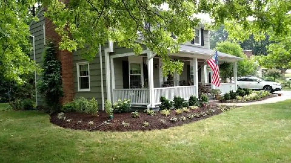 front of home with mulch with plants in landscape design
