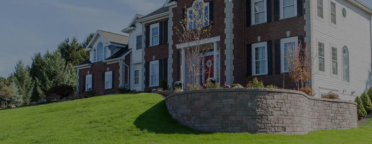 beautiful two story brick home with pavers in front yard