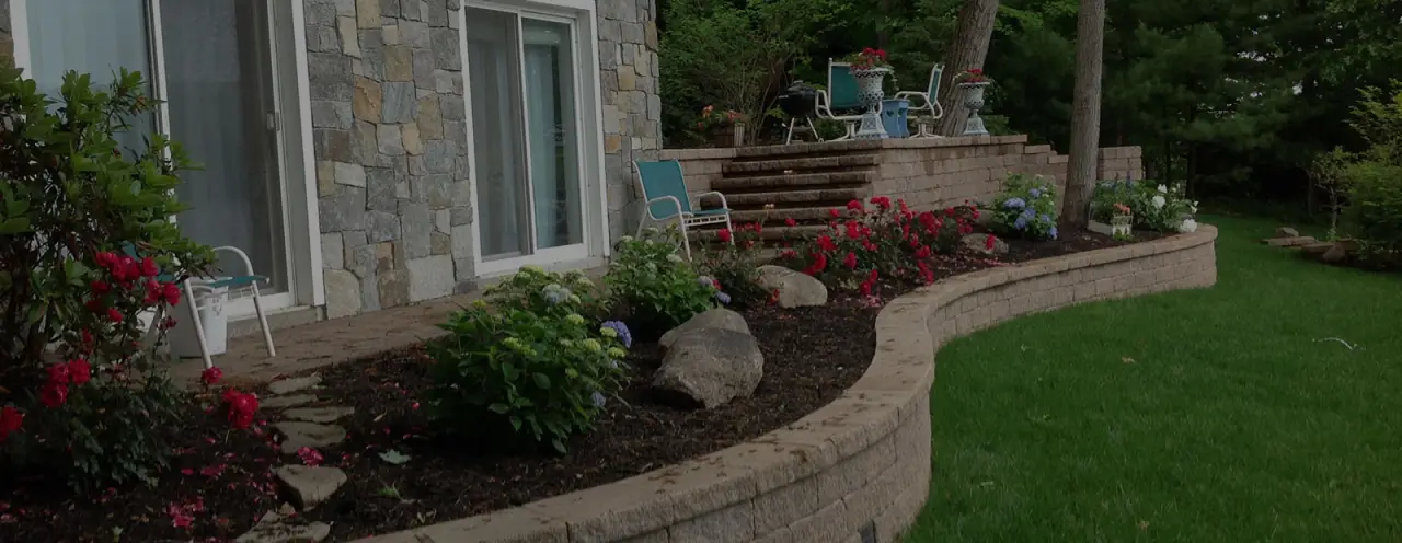 stone pavers filled with mulch and flower beds