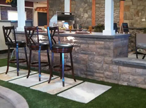 home outdoor kitchen with stone island
