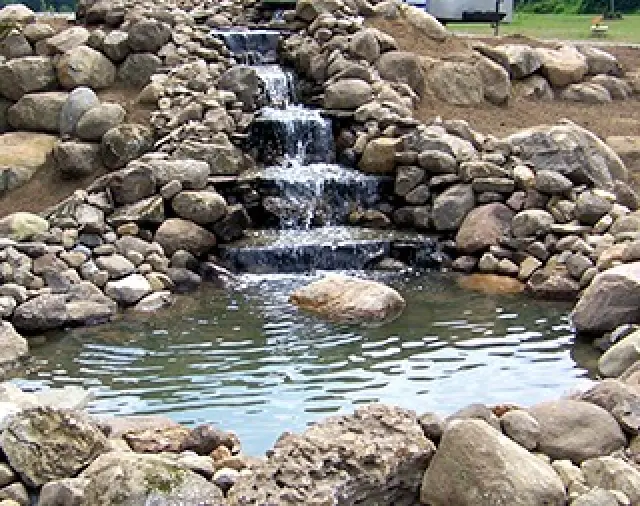 stone waterfall with steps cascading water