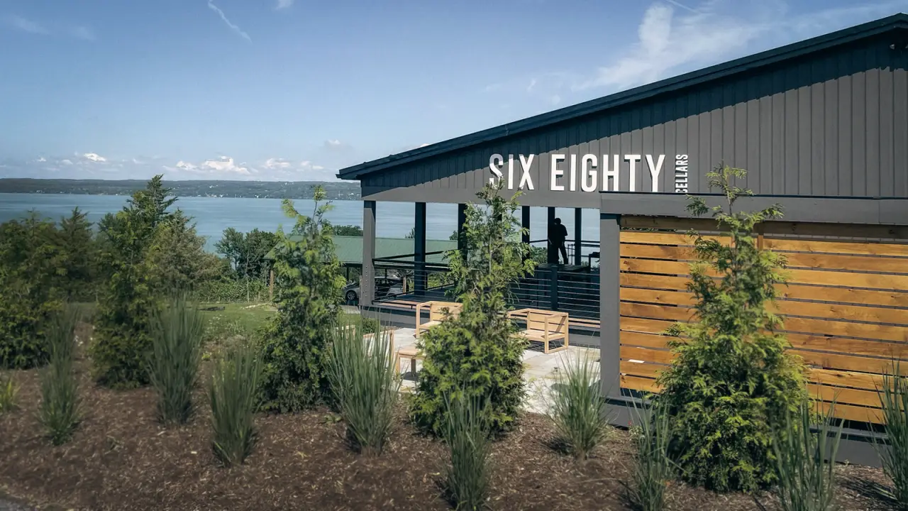 The Six Eighty Cellars tasting room building behind young landscaping