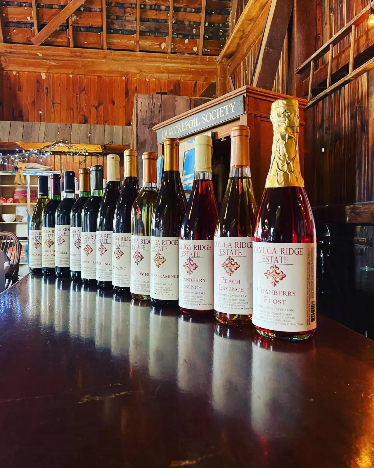 A row of Cayuga Ridge Estate Winery bottles lined up on the tasting bar
