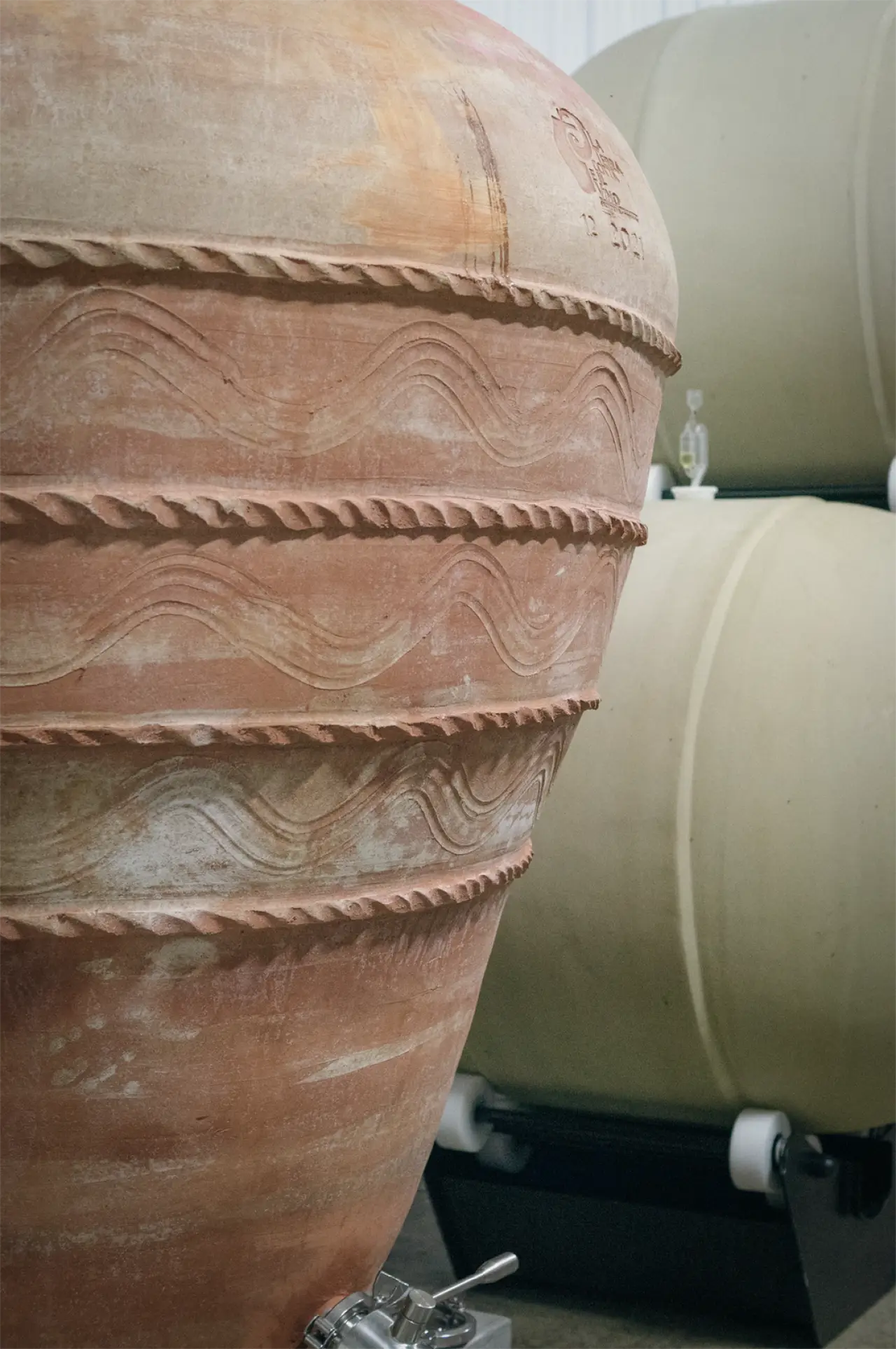 A terracotta amphora used for ageing wine in the cellar