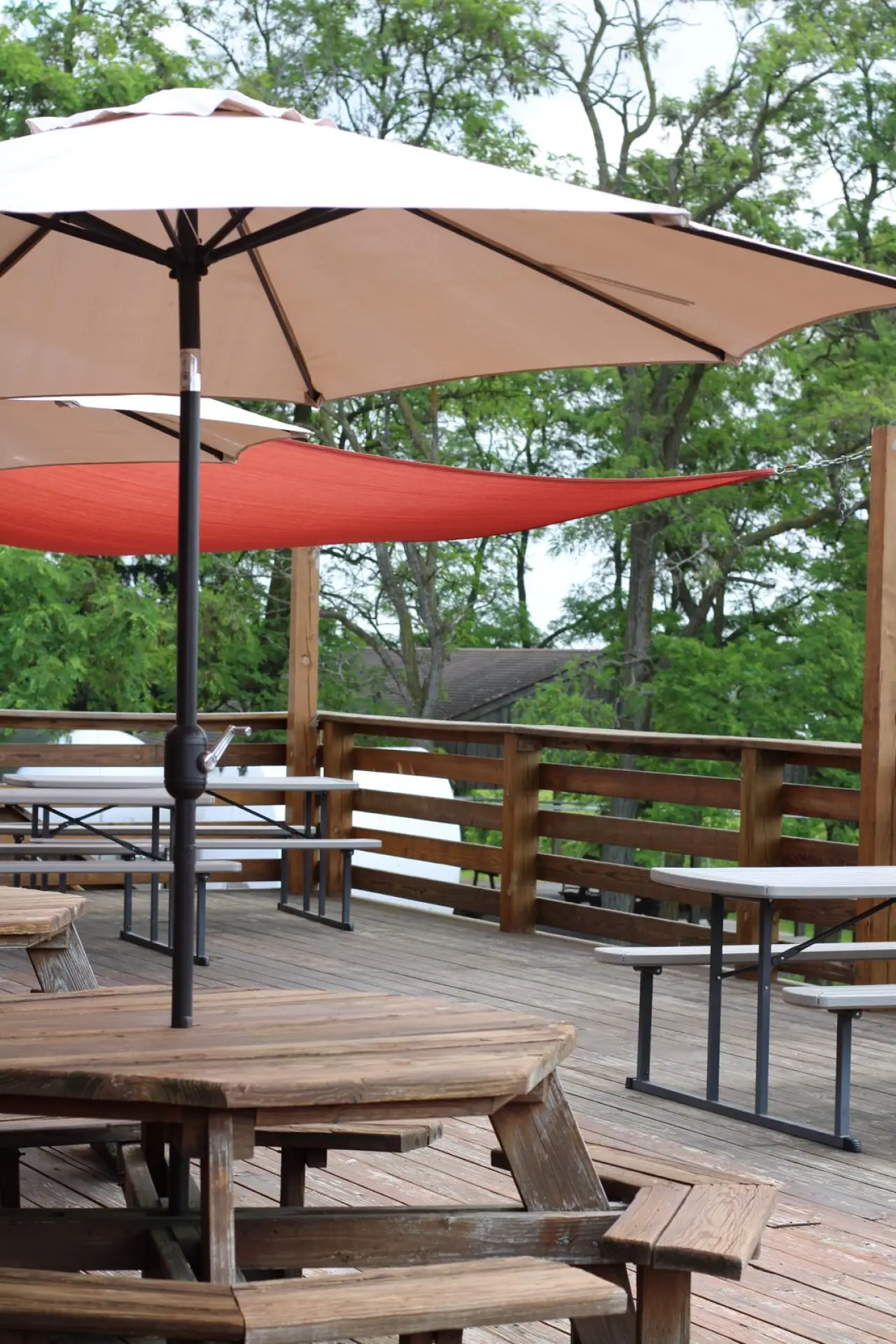 Umbrellas and wooden furniture on the deck