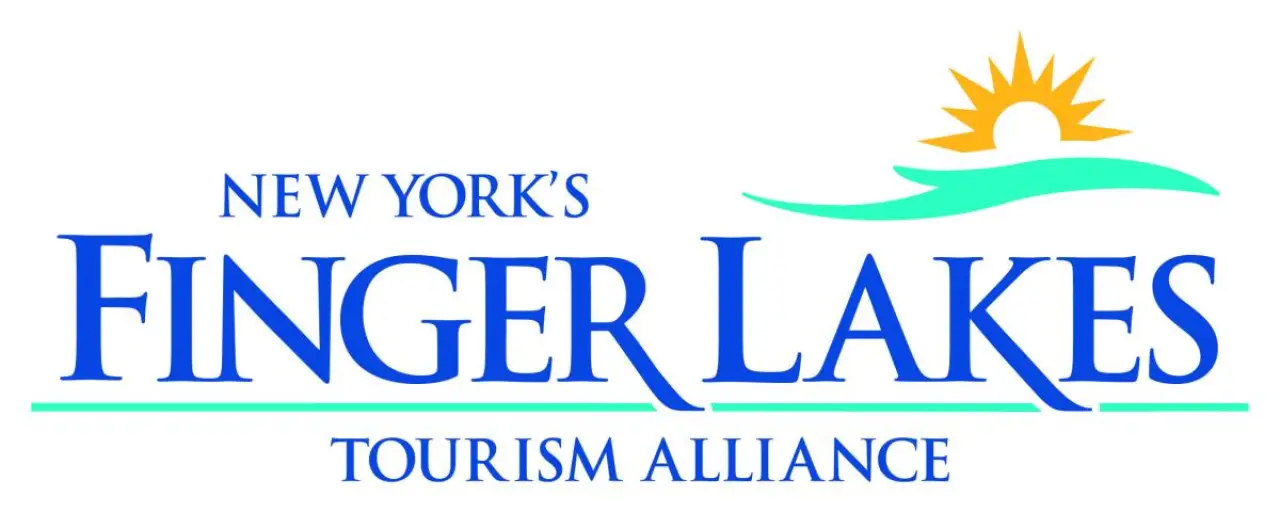 Logo for New York’s Finger Lakes Tourism Alliance with a sun over water graphic.