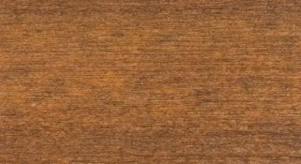 A close-up view of a brown wooden surface with visible natural grain and texture.