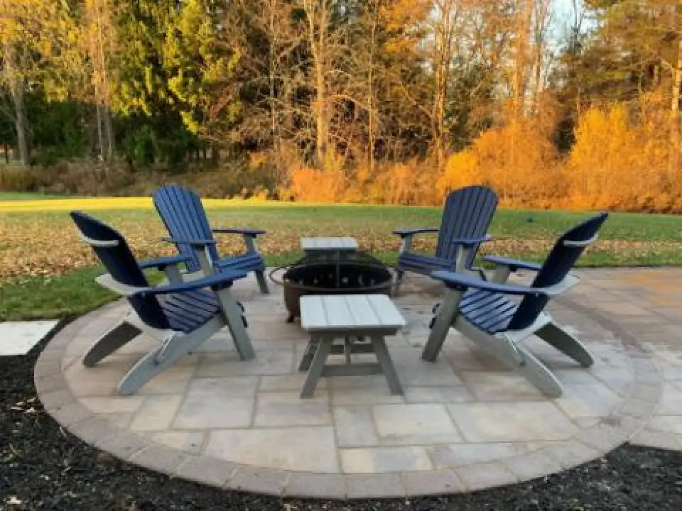 adirondack chairs around a fire pit