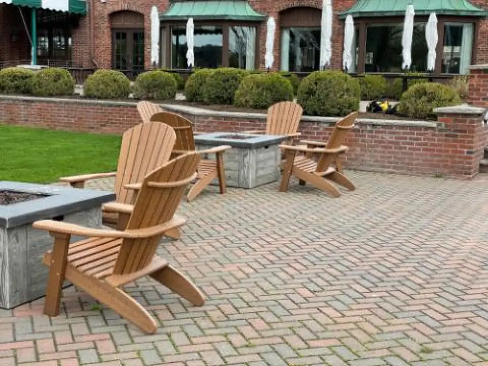 adirondack furniture on a brick patio