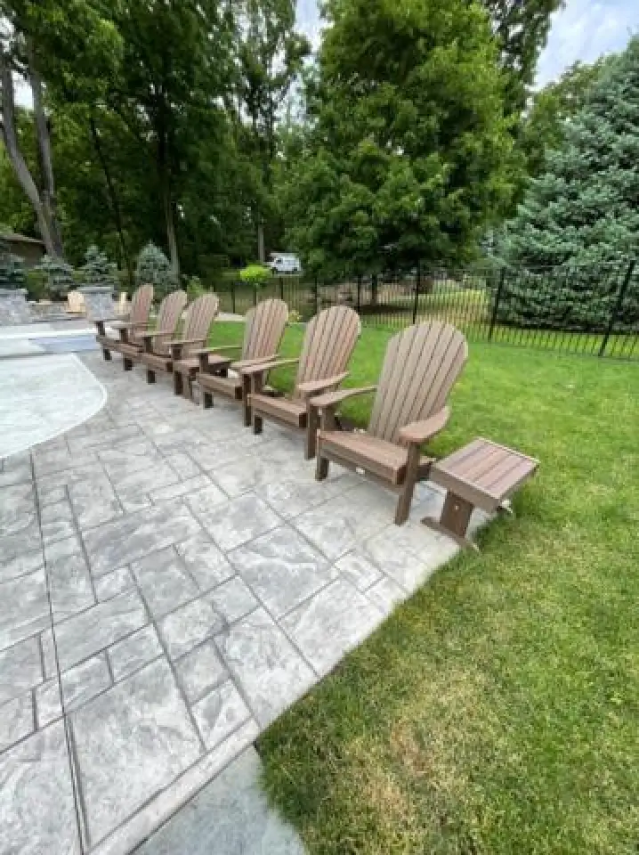 brown adirondack chairs on a patio