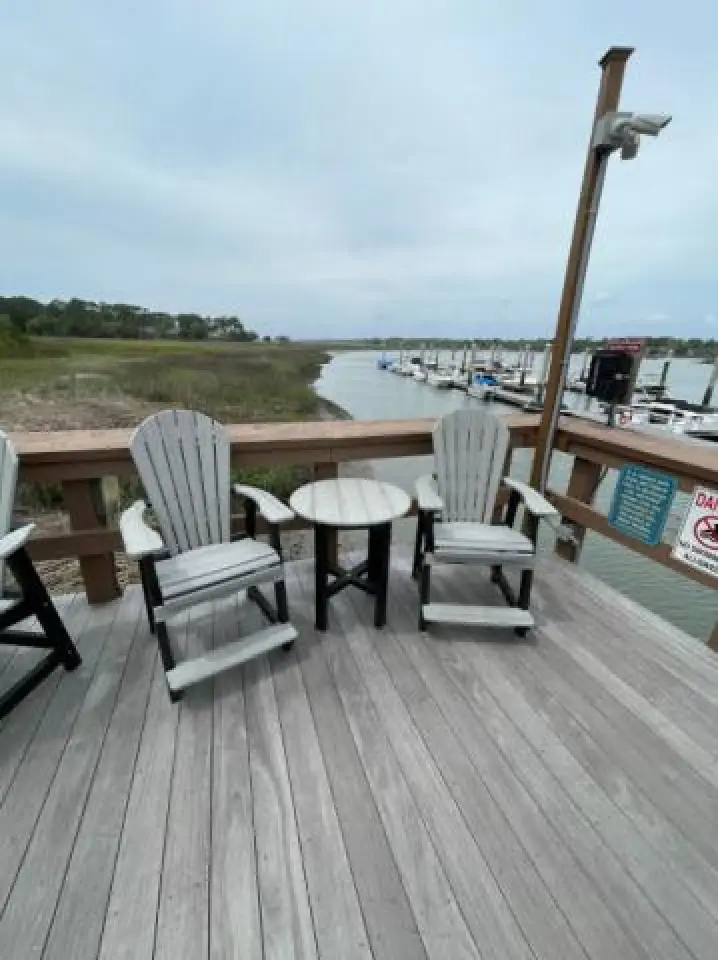 adirondack chairs with a grey table