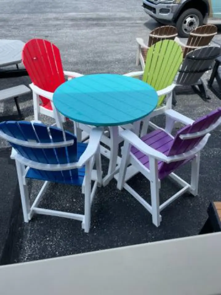 colored adirondack chairs with table