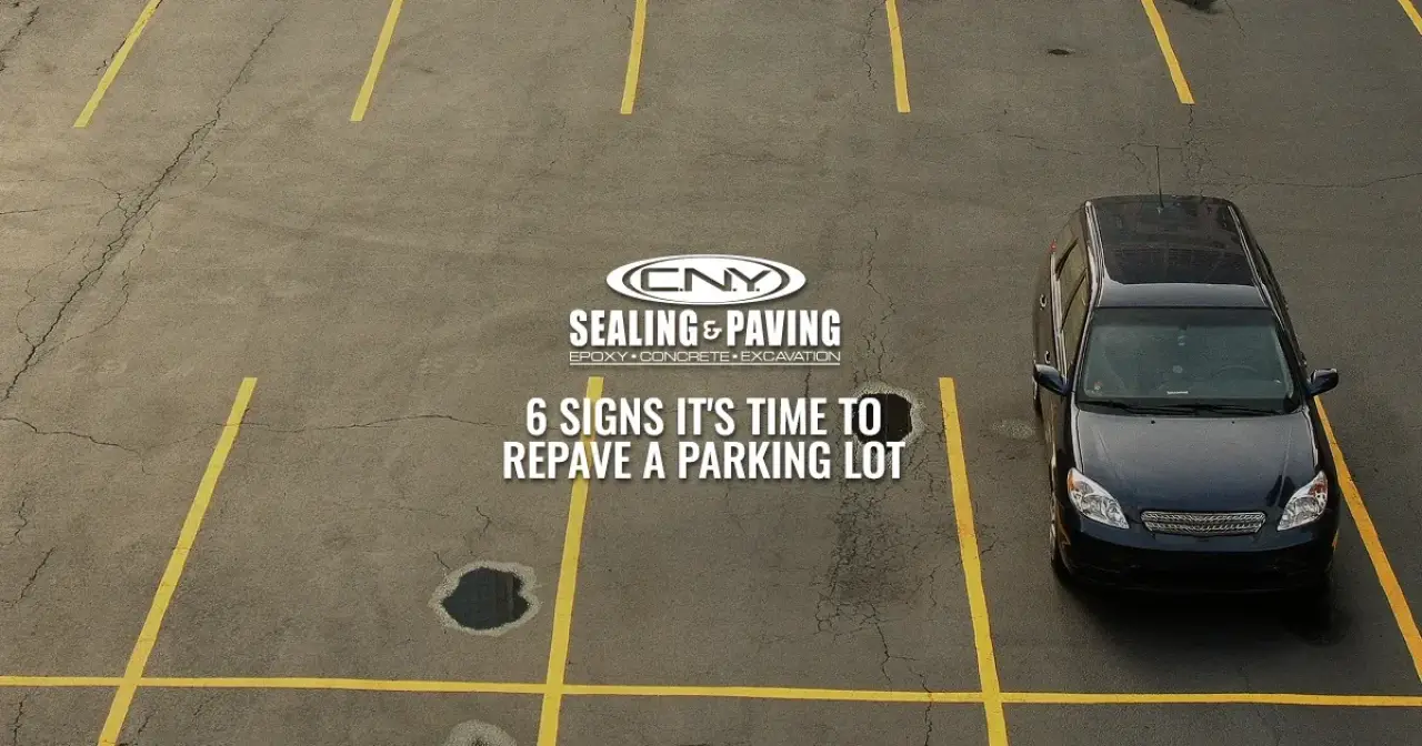 A parking lot with cracks and potholes, one parked car, and text about repaving signs.