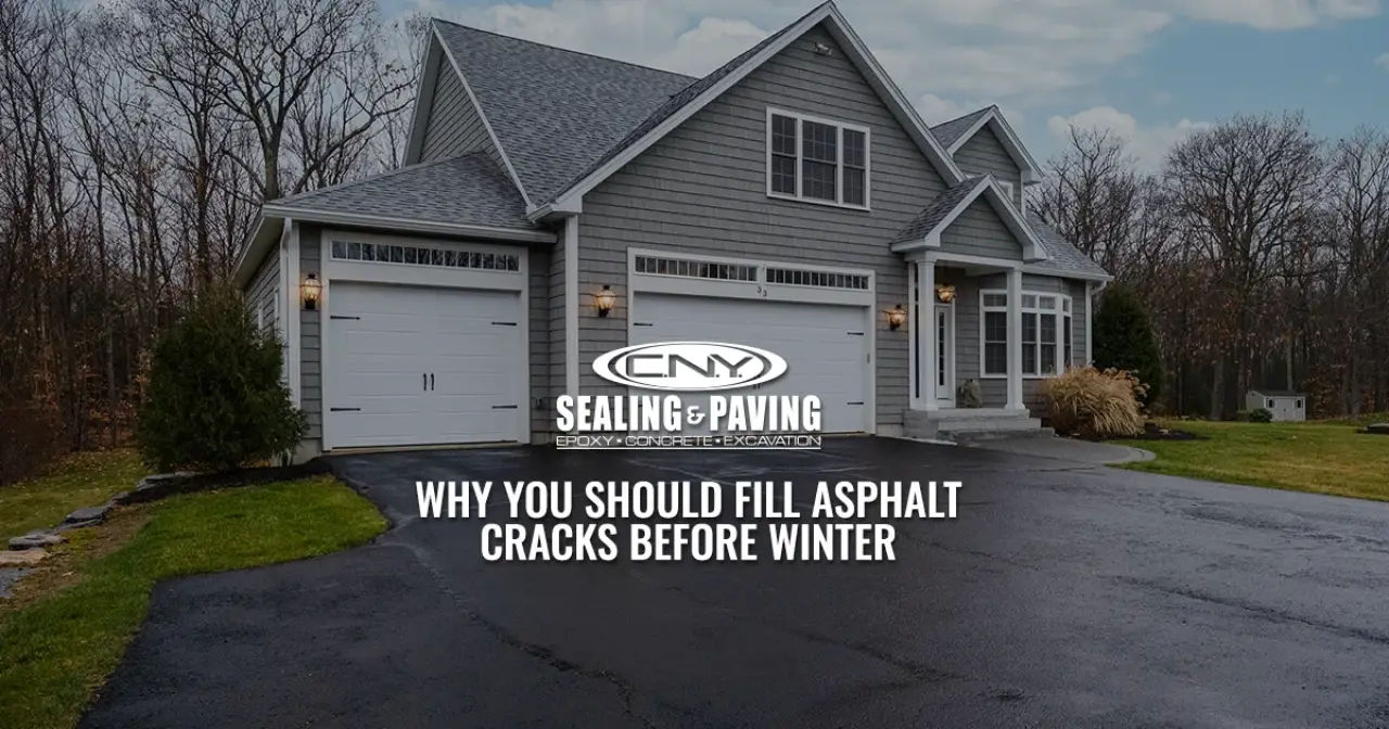 A house with an asphalt driveway and text about filling cracks before winter.