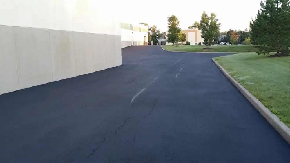 Crack filling service on an asphalt surface