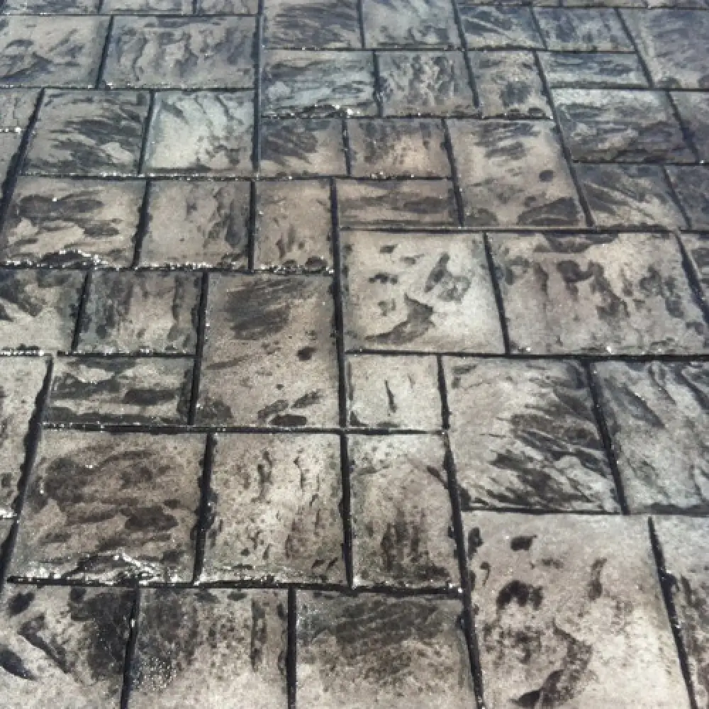 Small ashlar slate stamped concrete sample with blue highlights