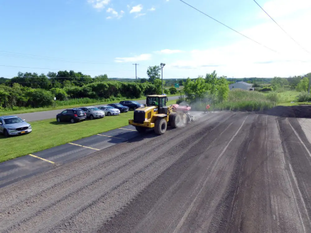 Asphalt milling machine working on a commercial pavement surface