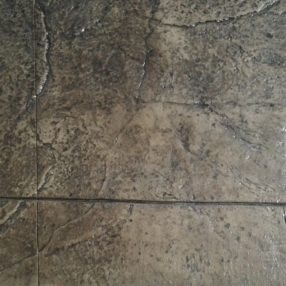 Sandstone textured stamped concrete sample with border
