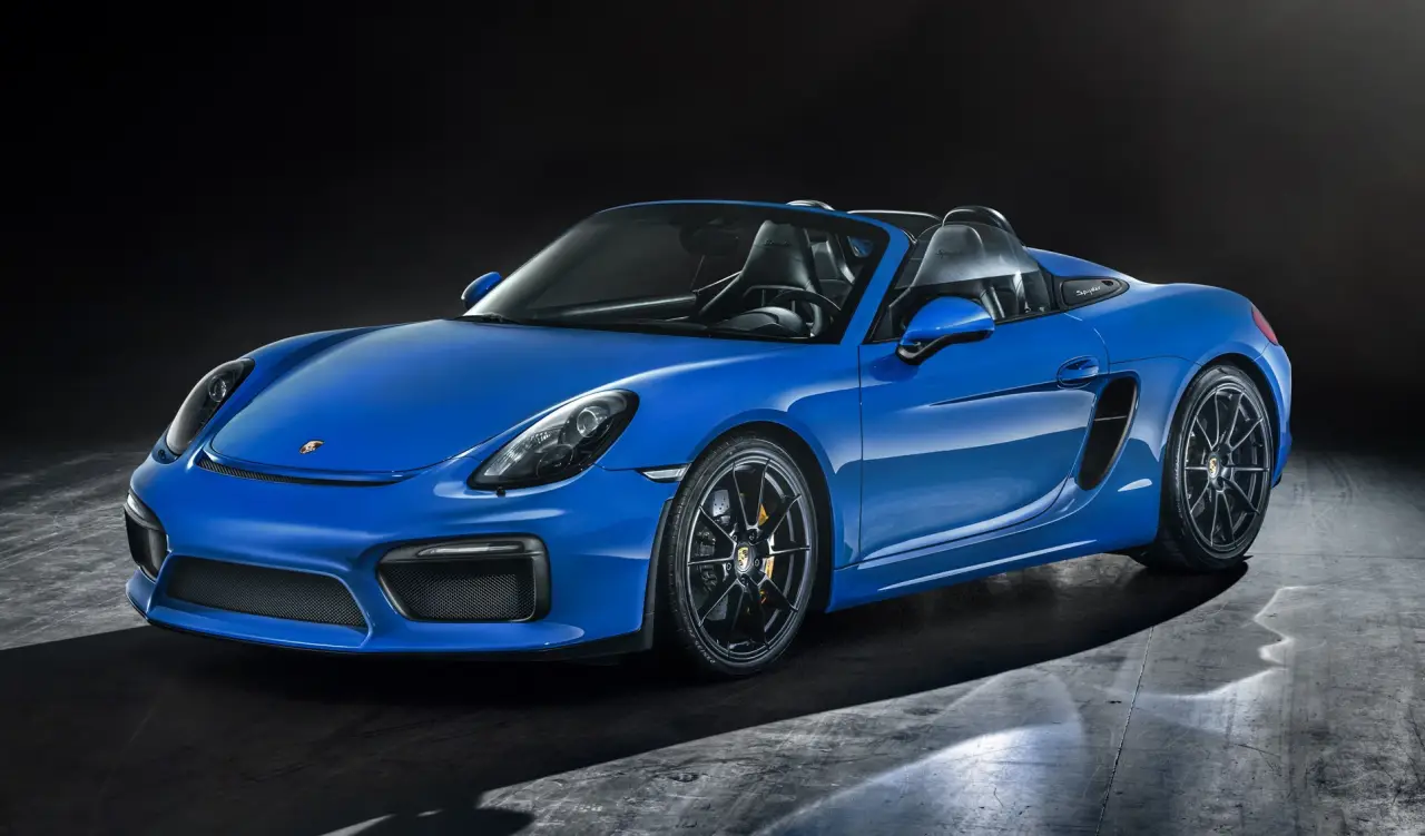 blue spyder Porsche in garage