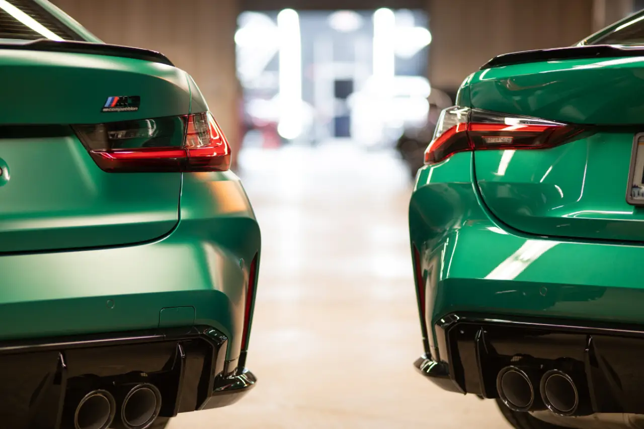 two green 2023 bmw m3 competitions