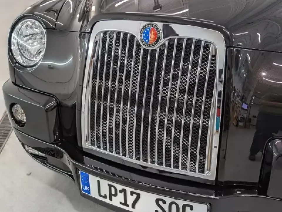 classic black London taxi front grille and headlight detail
