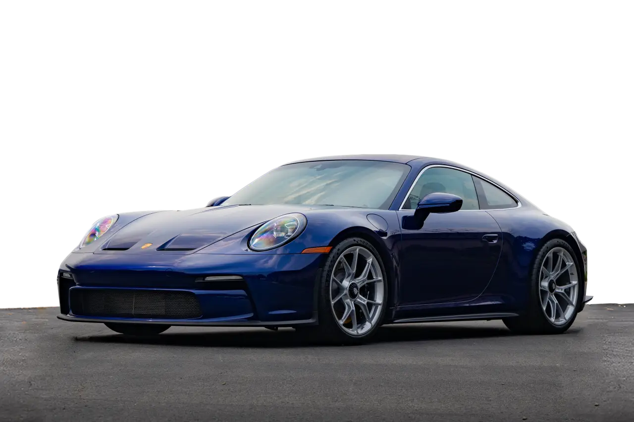 dark blue porsche in parking lot