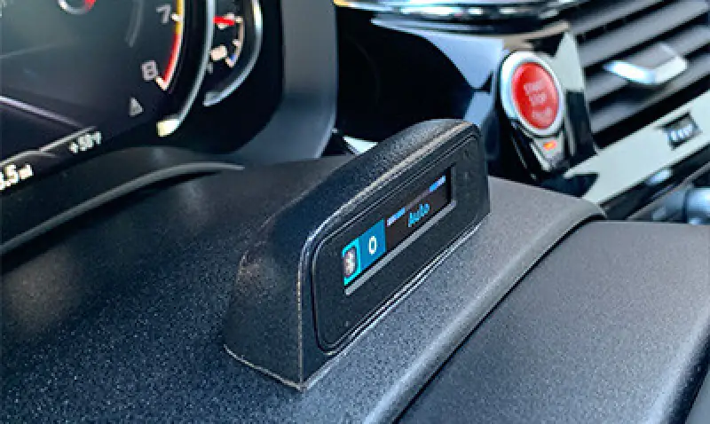 man installing a radar detector in his car