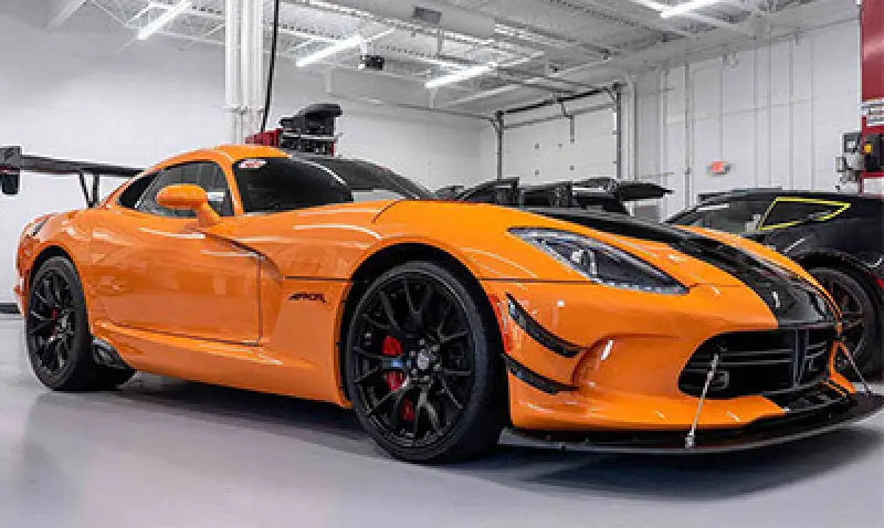 orange car with stek paint protection film