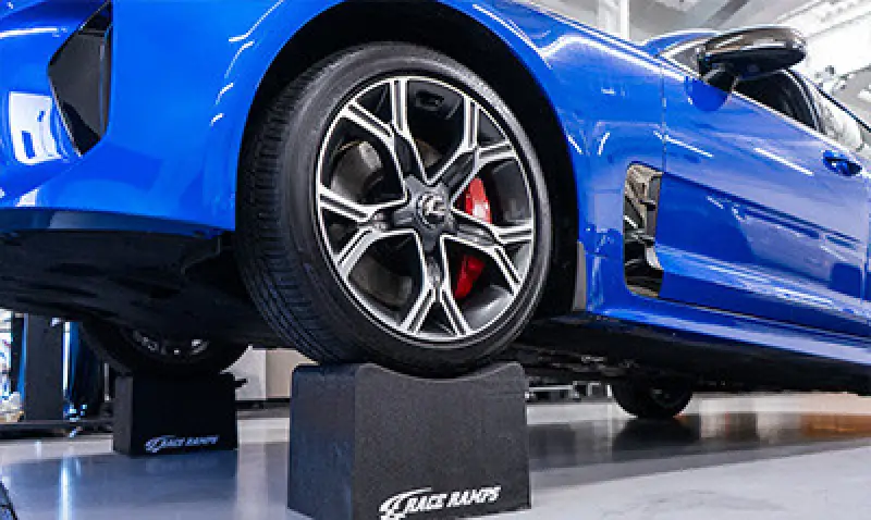 wheel with cars in background