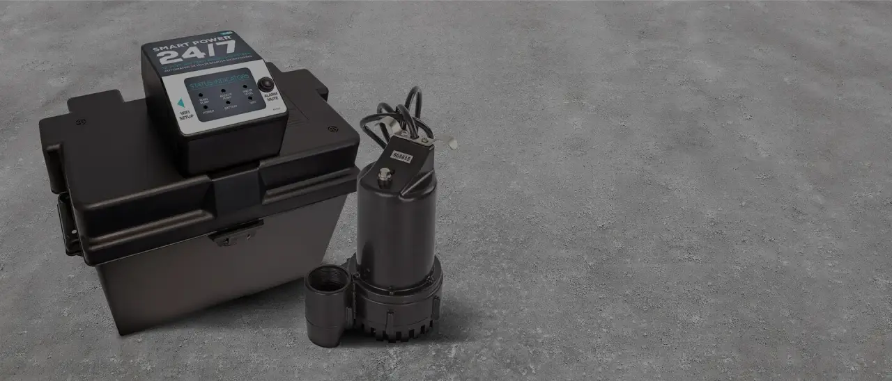 Black battery box with control panel and a submersible pump on a textured gray surface.