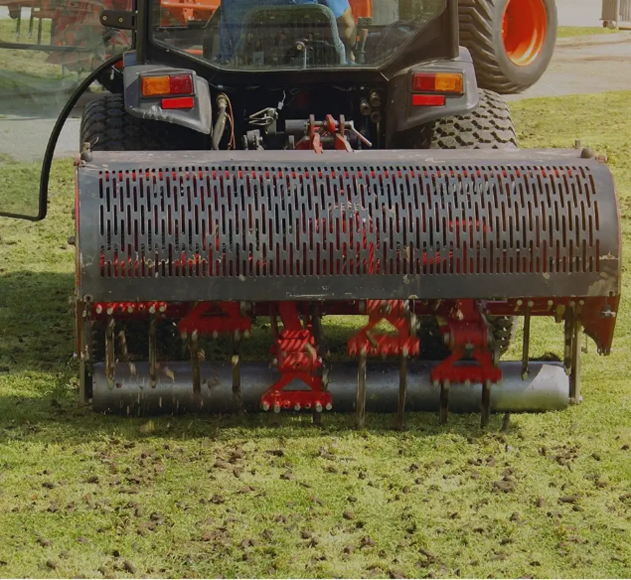 Machine seeding a lawn