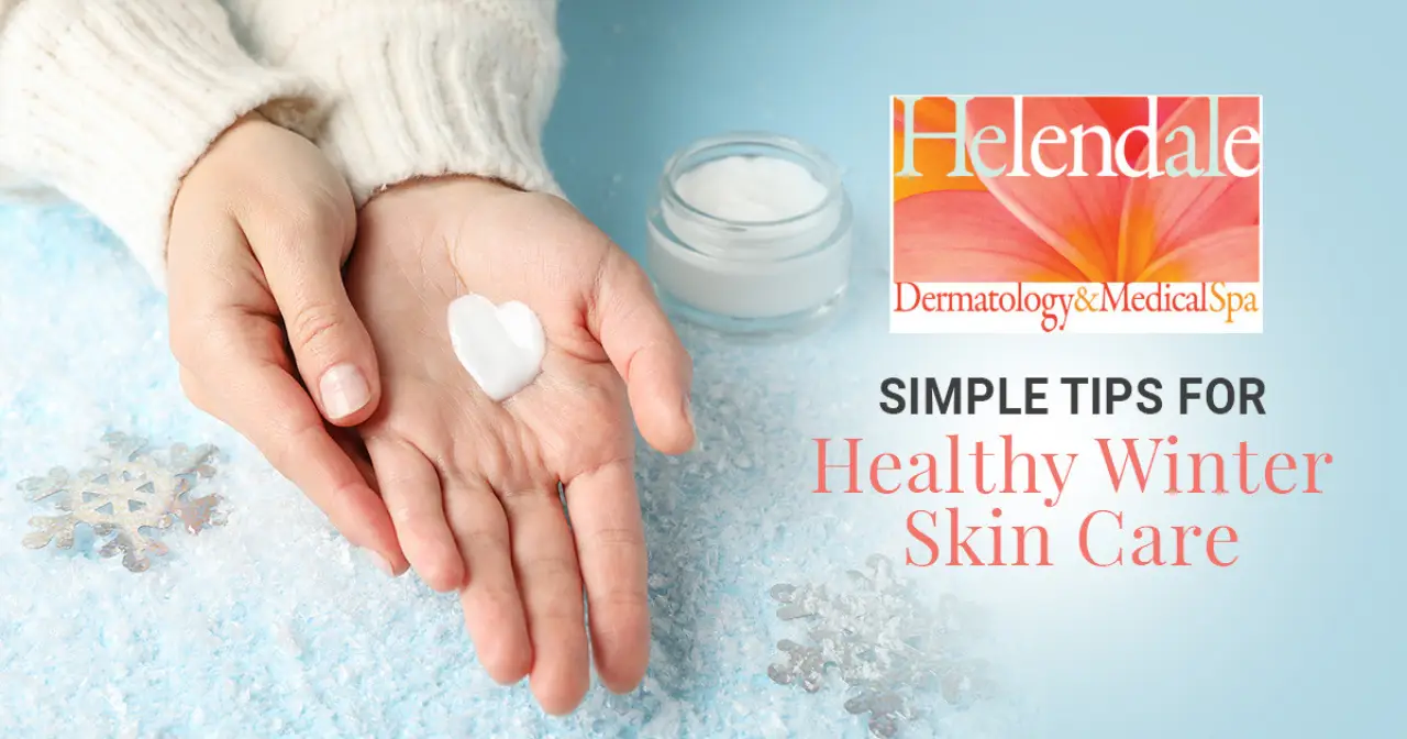 Hands holding moisturizer for healthy winter skin care.