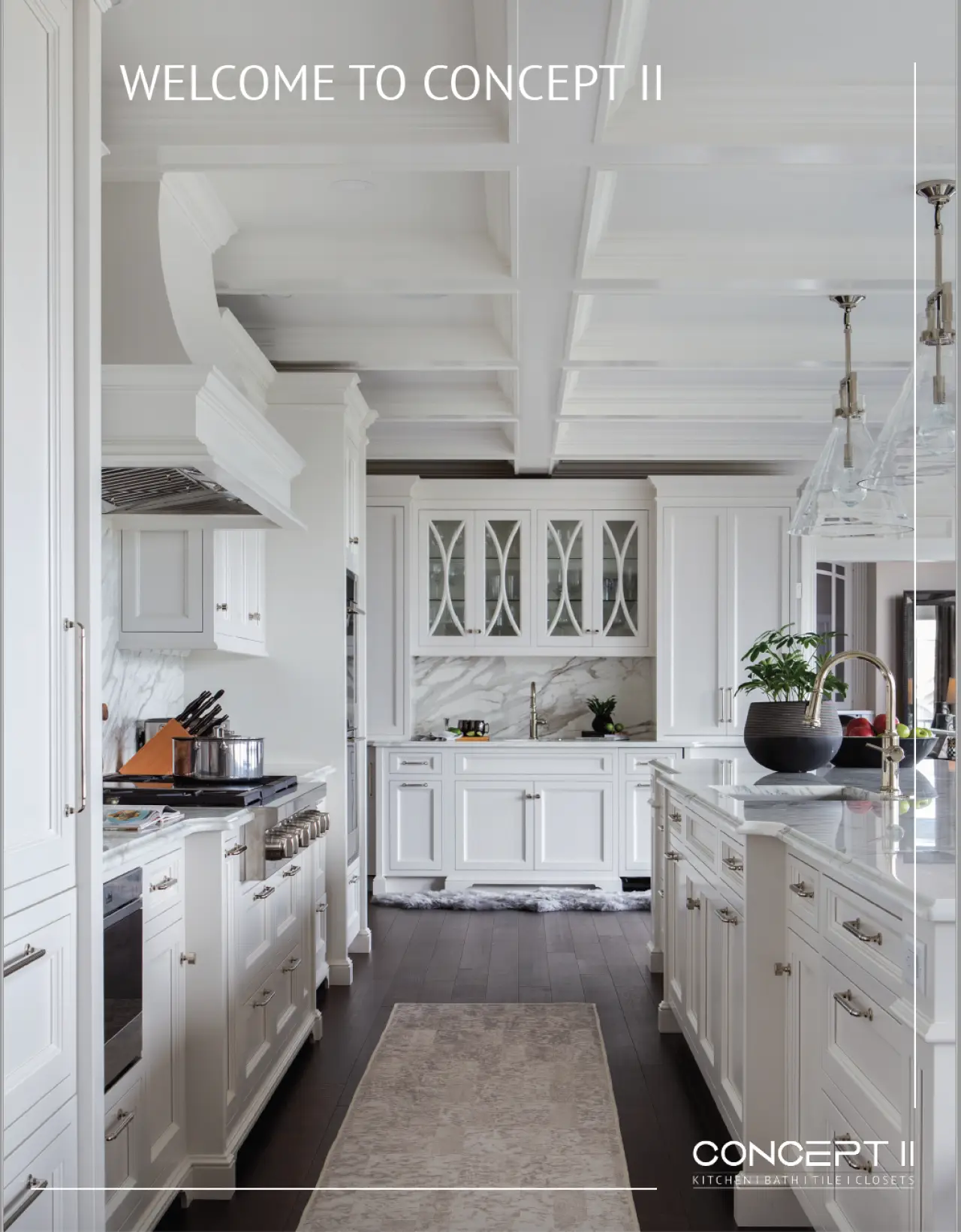 Custom kitchen design by Concept II featuring white cabinetry and elegant finishes.