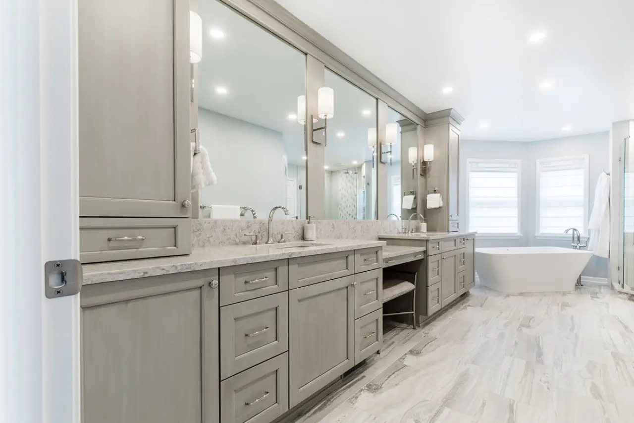a room with a sink and a mirror