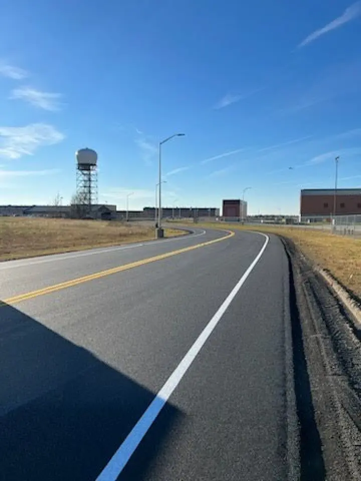 road line striping leading to a building