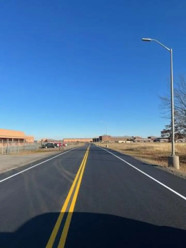 fresh line striping down road to a secure building lot